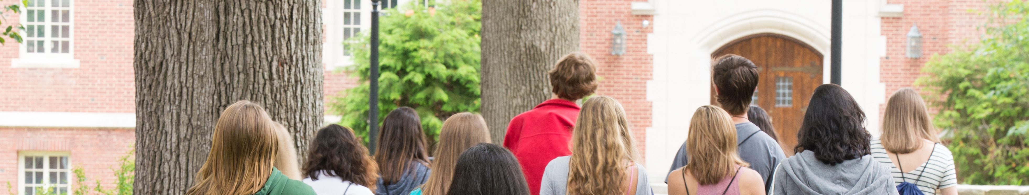 Prospective students at orientation with UConn drawstring bags